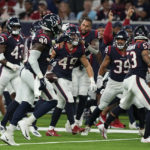 
              Houston Texans linebacker Jake Hansen (49) celebrates with teammate after he intercepted a pass against the San Francisco 49ers during the second half of an NFL football game Thursday, Aug. 25, 2022, in Houston. (AP Photo/David J. Phillip)
            