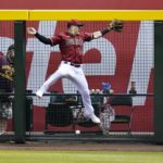 
              Arizona Diamondbacks right fielder Daulton Varsho leaps in vain for a triple hit by Pittsburgh Pirates' Rodolfo Castro during the sixth inning of a baseball game Wednesday, Aug. 10, 2022, in Phoenix. (AP Photo/Ross D. Franklin)
            