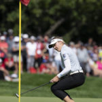 
              Canada's Brooke Henderson reacts as she fails to make a putt on the 18th hole during the third round of the CP Women's Open golf tournament Saturday, Aug. 27, 2022, in Ottawa, Ontario. (Adrian Wyld/The Canadian Press via AP)
            