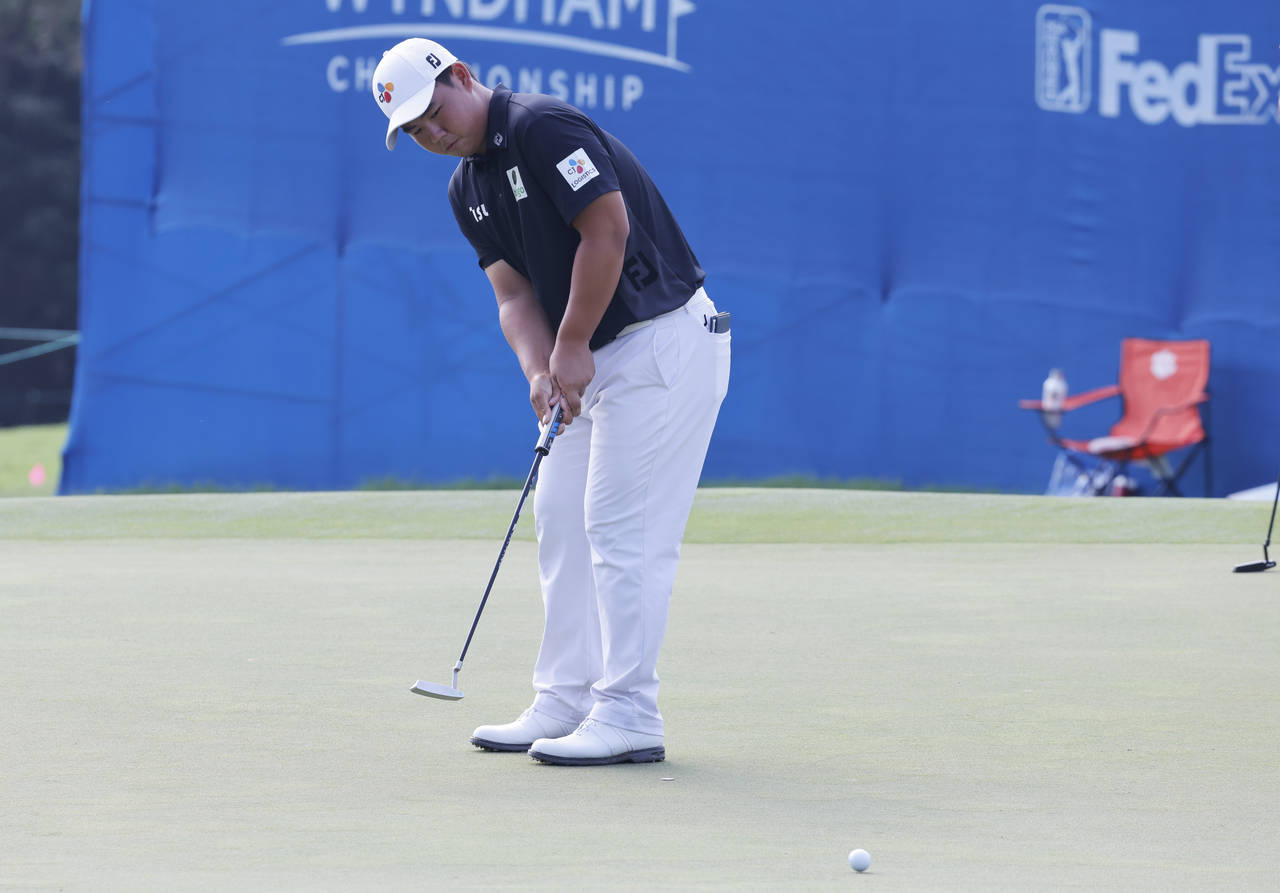 Joohyung Kim from Korea putts on the ninth green during the second round of the Wyndham Championshi...