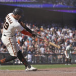 
              San Francisco Giants' Thairo Estrada hits a two-run home run during the ninth inning of a baseball game against the Pittsburgh Pirates in San Francisco, Sunday, Aug. 14, 2022. (AP Photo/Jeff Chiu)
            