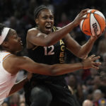 
              Las Vegas Aces guard Chelsea Gray (12) shoots over Phoenix Mercury's Kaela Davis during the first half in Game 2 of a WNBA basketball first-round playoff series Saturday, Aug. 20, 2022, in Las Vegas. (AP Photo/John Locher)
            