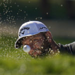 
              Jon Rahm, of Spain, hits out of the bunker on the 14th hole during the first round of the BMW Championship golf tournament at Wilmington Country Club, Thursday, Aug. 18, 2022, in Wilmington, Del. (AP Photo/Julio Cortez)
            