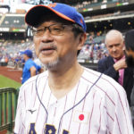 
              The Japanese consul-general in New York, Ambassador Mikio Mori, waits to throw out a ceremonial first pitch before a baseball game between the New York Mets and the Colorado Rockies, Thursday, Aug. 25, 2022, in New York. (AP Photo/Frank Franklin II)
            