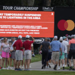 
              Golf fans leave the course after play was suspended due to weather during the third round of the Tour Championship golf tournament at East Lake Golf Club Saturday, Aug. 27, 2022, in Atlanta. (AP Photo/Steve Helber)
            