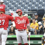 
              Cincinnati Reds teammates Jake Fraley (27) and Jonathan India (6) celebrate Fraley's leadoff home run near Pittsburgh Pirates catcher Jason Delay, right, during the first inning of a baseball game, Sunday, Aug. 21, 2022, in Pittsburgh. (AP Photo/Philip G. Pavely)
            