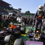 
              Red Bull driver Max Verstappen of the Netherlands stands on his car in the Parc Ferme after winning the Formula One Grand Prix at the Spa-Francorchamps racetrack in Spa, Belgium, Sunday, Aug. 28, 2022. (AP Photo/Geert Vanden Wijngaert, Pool)
            