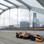 
              Pato O'Ward crosses a bridge during a practice session for the Music City Grand Prix auto race Friday, Aug. 5, 2022, in Nashville, Tenn. The race is scheduled for Sunday, Aug. 7. (AP Photo/Mark Humphrey)
            