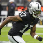 
              FILE - Las Vegas Raiders wide receiver Davante Adams (17) warms up before an NFL preseason football game against the Minnesota Vikings on Aug. 14, 2022, in Las Vegas. Davante Adams, Tyreek Hill, A.J. Brown, Super Bowl MVP Cooper Kupp and even Christian Kirk are among the wide receivers who reset the market for just how well the NFL pays the best at that position this year. Now comes the tough part: Proving they're worth all those millions and millions of dollars.  (AP Photo/Rick Scuteri, File)
            