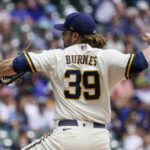 
              Milwaukee Brewers starting pitcher Corbin Burnes throws during the first inning of a baseball game against the Los Angeles Dodgers Thursday, Aug. 18, 2022, in Milwaukee. (AP Photo/Morry Gash)
            