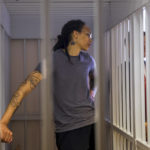 
              WNBA star and two-time Olympic gold medalist Brittney Griner listens to the verdict standing in a cage in a courtroom in Khimki just outside Moscow, Russia, Thursday, Aug. 4, 2022. A judge in Russia has convicted American basketball star Brittney Griner of drug possession and smuggling and sentenced her to nine years in prison. (Evgenia Novozhenina/Pool Photo via AP)
            