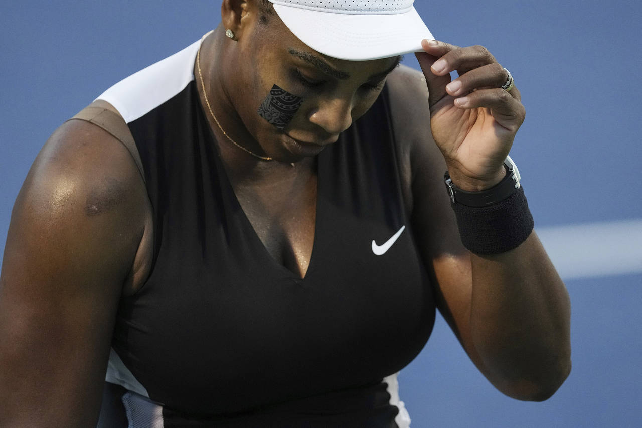 Serena Williams, of the United States, reacts after her loss to Belinda Bencic, of Switzerland, dur...