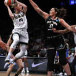 
              Chicago Sky guard Allie Quigley (14) looks to pass against New York Liberty center Stefanie Dolson (31) during the first half of a WNBA basketball playoff game Tuesday, Aug. 23, 2022, in New York. (AP Photo/Noah K. Murray)
            