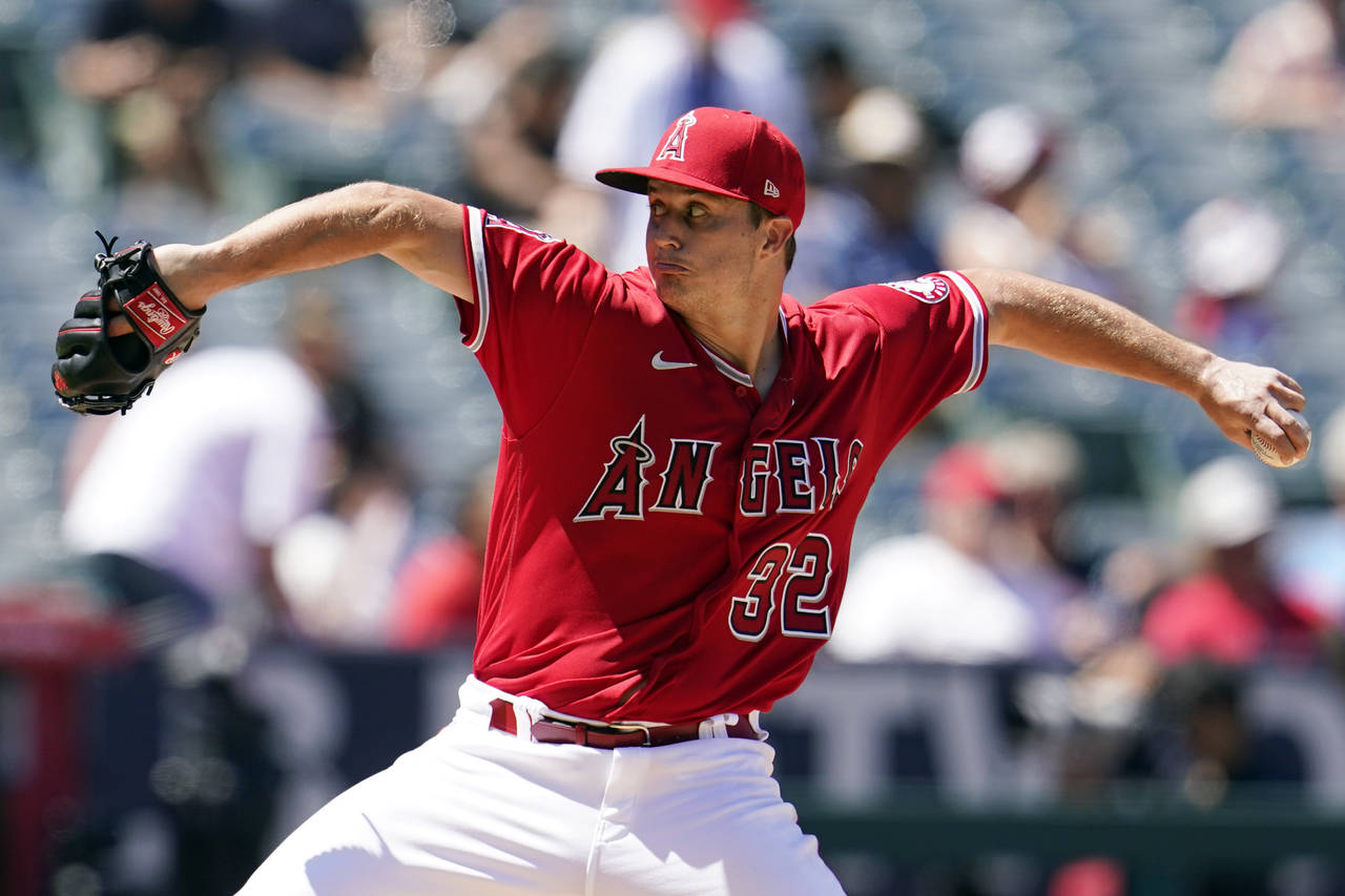Los Angeles Angels starting pitcher Tucker Davidson throws to a Minnesota Twins batter during the f...