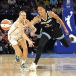 
              Chicago Sky's Candace Parker (3) knocks the ball away from New York Liberty's Marine Johannès during the first half in Game 2 of a WNBA basketball first-round playoff series Saturday, Aug. 20, 2022, in Chicago. (AP Photo/Charles Rex Arbogast)
            