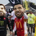 
              Caricatures of race car drivers greet fans before a NASCAR Cup Series auto race in Watkins Glen, N.Y., Sunday, Aug. 21, 2022. (AP Photo/Seth Wenig)
            