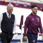 
              West Ham United manager David Moyes, left, and West Ham player Declan Rice walk the pitch prior to their Premier League match against Brighton & Hove Albion Football Club at London Stadium, in London, Sunday Aug. 21, 2022. (John Walton/PA via AP)
            