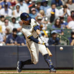 
              Milwaukee Brewers' Mike Brosseau (20) hits a run-scoring single against the Tampa Bay Rays during the first inning of a baseball game Wednesday, Aug. 10, 2022, in Milwaukee. (AP Photo/Jeffrey Phelps)
            