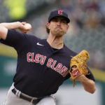 
              Cleveland Guardians pitcher Shane Bieber throws against the Detroit Tigers in the first inning of a baseball game in Detroit, Tuesday, Aug. 9, 2022. (AP Photo/Paul Sancya)
            