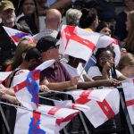 
              England supporters gather as they wait for the arrival of their national soccer team at Trafalgar Square in London, Monday, Aug. 1, 2022. England beat Germany 2-1 and won the final of the Women's Euro 2022 on Sunday. (AP Photo/Frank Augstein)
            