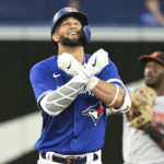 
              Toronto Blue Jays' Lourdes Gurriel Jr. reacts after hitting a double against the Baltimore Orioles during the third inning of a baseball game Tuesday, Aug. 16, 2022, in Toronto. (Jon Blacker/The Canadian Press via AP)
            