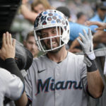 
              Miami Marlins' Jacob Stallings celebrates after his fifth-inning two-run home run against the Chicago Cubs during a baseball game, Sunday, Aug. 7, 2022, at Wrigley Field in Chicago. (AP Photo/Mark Black)
            