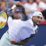 
              FILE - Nick Kyrgios of Australia serves to Daniil Medvedev during second round play at the National Bank Open tennis tournament Wednesday Aug. 10, 2022. in Montreal. Kyrgios will compete in the U.S. Open tennis tournament that begins Monday. (Paul Chiasson/The Canadian Press via AP, File)
            