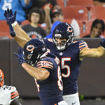 
              Chicago Bears tight end Cole Kmet (85) celebrates with Ryan Griffin, left, after he makes a touchdown catch from Justin Fields during the first half of an NFL preseason football game against the Cleveland Browns, Saturday, Aug. 27, 2022, in Cleveland. (AP Photo/David Richard)
            