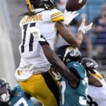 
              Pittsburgh Steelers wide receiver Chase Claypool (11) makes a reception over Jacksonville Jaguars cornerback Tre Herndon during the first half of an NFL preseason football game, Saturday, Aug. 20, 2022, in Jacksonville, Fla. (AP Photo/Phelan M. Ebenhack)
            
