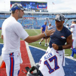 
              Buffalo Bills quarterback Josh Allen, left, and Denver Broncos quarterback Russell Wilson greet one another after they exchange jerseys after a preseason NFL football game, Saturday, Aug. 20, 2022, in Orchard Park, N.Y. (AP Photo/Jeffrey T. Barnes)
            