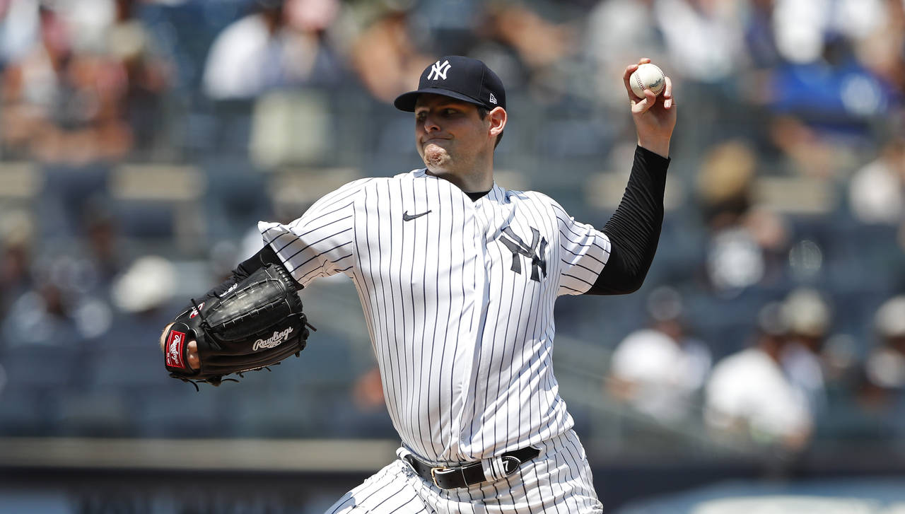 New York Yankees starting pitcher Jordan Montgomery throws against the Kansas City Royals during th...