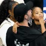 
              Olympia Ohanian blows a kiss to the crowd while in the arms of her father Alexis Ohanian during the first round of the US Open tennis championships, Monday, Aug. 29, 2022, in New York. (AP Photo/Frank Franklin II)
            