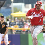 
              Cincinnati Reds' Mike Moustakas (9) rounds the bases after hitting a two-run home run off Pittsburgh Pirates pitcher Zach Thompson during the third inning of a baseball game, Sunday, Aug. 21, 2022, in Pittsburgh. (AP Photo/Philip G. Pavely)
            