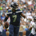 
              Seattle Seahawks quarterback Geno Smith (7) drops to pass as Chicago Bears' Kyler Gordon (6) closes in during the first half of a preseason NFL football game, Thursday, Aug. 18, 2022, in Seattle. (AP Photo/Caean Couto)
            