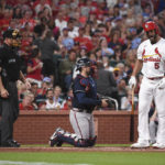 
              St. Louis Cardinals' Albert Pujols (5) reacts after a called strike three by umpire Dan Iassogna (58) in the second inning of a baseball game against the Atlanta Braves on Friday, Aug. 26, 2022, in St. Louis. (AP Photo/Joe Puetz)
            