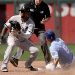 
              Kansas City Royals' Nicky Lopez (8) is caught stealing second by Chicago White Sox shortstop Elvis Andrus during the sixth inning of a baseball game Monday, Aug. 22, 2022, in Kansas City, Mo. (AP Photo/Charlie Riedel)
            