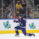 
              USA's Brett Berard (21) celebrates a goal against Sweden during first period IIHF World Junior Hockey Championship action in Edmonton, Alberta, Sunday, Aug. 14, 2022. (Jason Franson/The Canadian Press via AP)
            