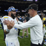 
              Los Angeles Chargers quarterback Chase Daniel greets New Orleans Saints head coach Dennis Allen, right, after a preseason NFL football game in New Orleans, Friday, Aug. 26, 2022. The Saints won 27-10. (AP Photo/Gerald Herbert)
            