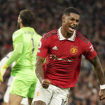 
              Manchester United's Marcus Rashford celebrates after scoring his side's second goal during the English Premier League soccer match between Manchester United and Liverpool at Old Trafford stadium, in Manchester, England, Monday, Aug 22, 2022. (AP Photo/Dave Thompson)
            