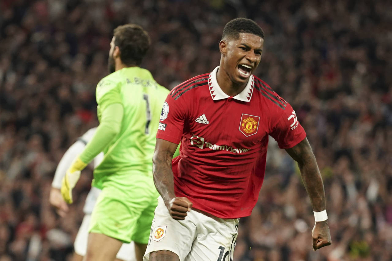 Manchester United's Marcus Rashford celebrates after scoring his side's second goal during the Engl...