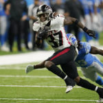 
              Atlanta Falcons cornerback Dee Alford (37) pulls away from Detroit Lions wide receiver Kalil Pimpleton (83) during the second half of a preseason NFL football game, Friday, Aug. 12, 2022, in Detroit. (AP Photo/Paul Sancya)
            