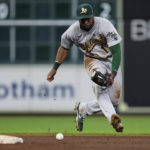 
              Oakland Athletics shortstop Elvis Andrus fields a grounder by Houston Astros' Trey Mancini, who was out at first during the seventh inning of a baseball game Saturday, Aug. 13, 2022, in Houston. (AP Photo/Kevin M. Cox)
            