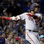 
              Washington Nationals' Keibert Ruiz watches his three-run home run off Chicago Cubs starting pitcher Marcus Stroman during the fourth inning of a baseball game Tuesday, Aug. 9, 2022, in Chicago. It was Ruiz's second homer of the game. (AP Photo/Charles Rex Arbogast)
            