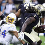 
              New Orleans Saints running back Alvin Kamara carries the ball up field during the first half of a preseason NFL football game against the Los Angeles Chargers in New Orleans, Friday, Aug. 26, 2022. (AP Photo/Butch Dill)
            