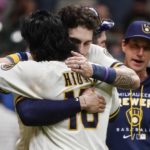 
              Milwaukee Brewers' Keston Hiura hugs Garrett Mitchell after a baseball game against the Pittsburgh Pirates Monday, Aug. 29, 2022, in Milwaukee. The Brewers won 7-5. (AP Photo/Morry Gash)
            