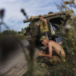 
              Ukrainian servicemen wait with their tank after experiencing mechanical issues on a country road near Kramatorsk, Donetsk region, eastern Ukraine, Wednesday, Aug. 10, 2022. (AP Photo/David Goldman)
            