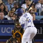 
              Los Angeles Dodgers' Will Smith, right, is hit by a pitch as San Diego Padres catcher Austin Nola watches during the fifth inning of a baseball game Saturday, Aug. 6, 2022, in Los Angeles. (AP Photo/Mark J. Terrill)
            