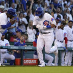 
              Chicago Cubs third base coach Willie Harris, left, greets Seiya Suzuki after Suzuki's home run off Washington Nationals starting pitcher Paolo Espino during the second inning of a baseball game Tuesday, Aug. 9, 2022, in Chicago. (AP Photo/Charles Rex Arbogast)
            