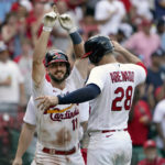 
              St. Louis Cardinals' Paul DeJong (11) is congratulated by teammate Nolan Arenado (28) after hitting a three-run home run during the eighth inning of a baseball game against the New York Yankees Sunday, Aug. 7, 2022, in St. Louis. (AP Photo/Jeff Roberson)
            