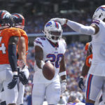 
              Buffalo Bills' Zack Moss, center, celebrates a touchdown during the first half of a preseason NFL football game against the Denver Broncos, Saturday, Aug. 20, 2022, in Orchard Park, N.Y. (AP Photo/Joshua Bessex)
            